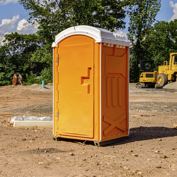 how often are the portable restrooms cleaned and serviced during a rental period in North Wales